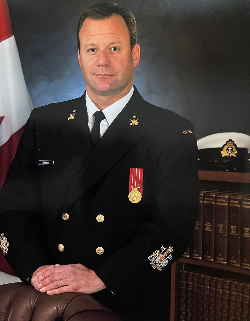 Headshot of Ryan Tompkins in his Navy uniform