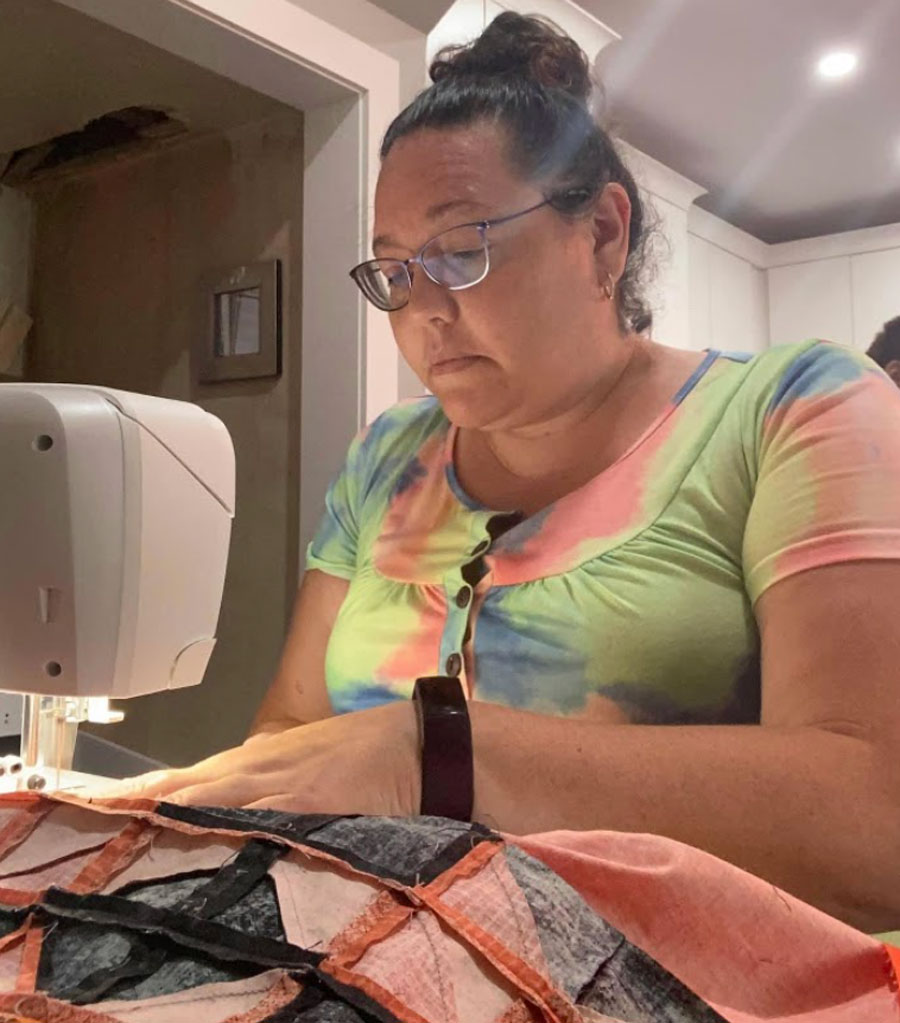 Vanessa Genier at work on a sewing machine