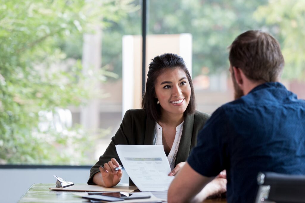 Counsellor speaking with a client in a clinical setting during a counselling practicum, demonstrating real-world training and supervision.