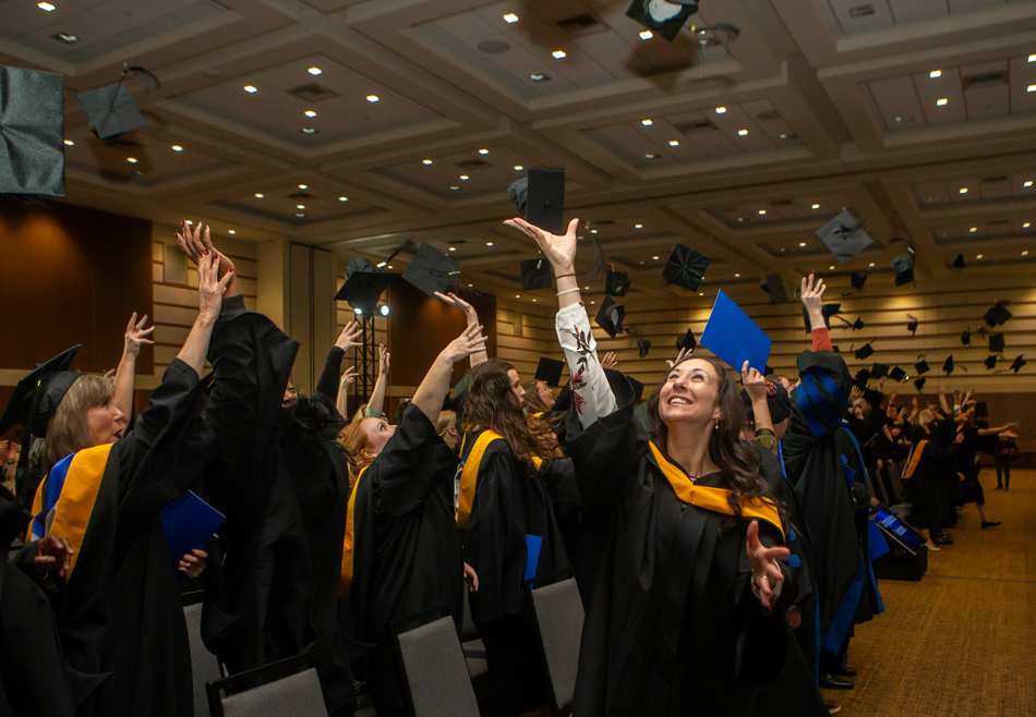 Cap toss at Yorkville's Fall 2025 Convocation in Fredericton
